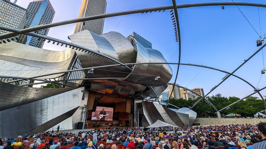 Crowd watching a performance at the Jay Pritzker Pavilion in Millennium Park