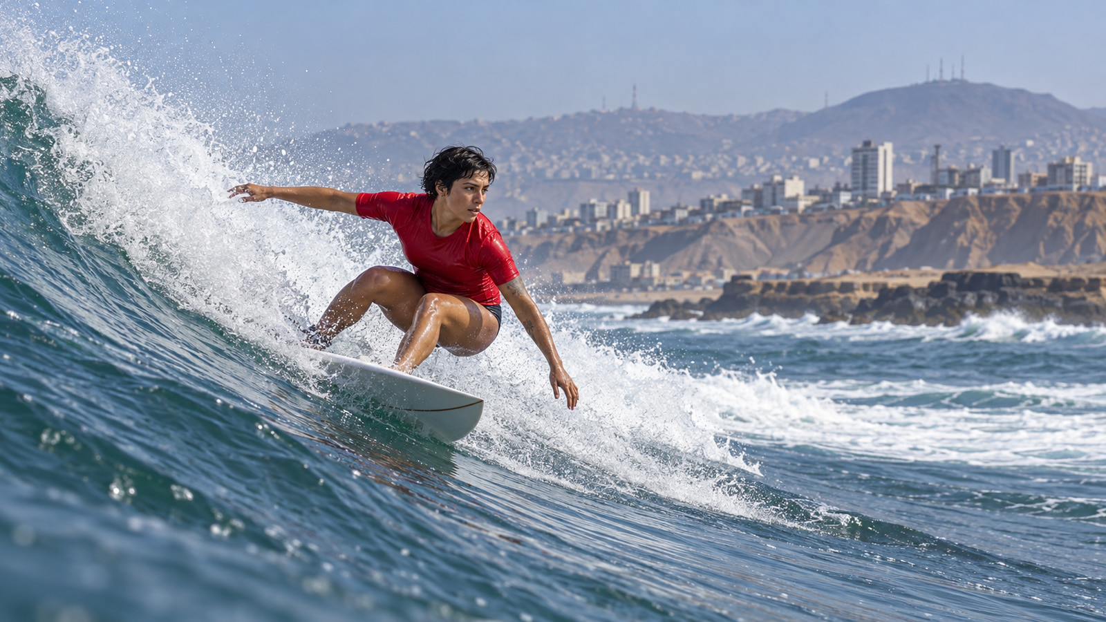 A surfer rides a Pacific wave at Punta Rocas near Lima