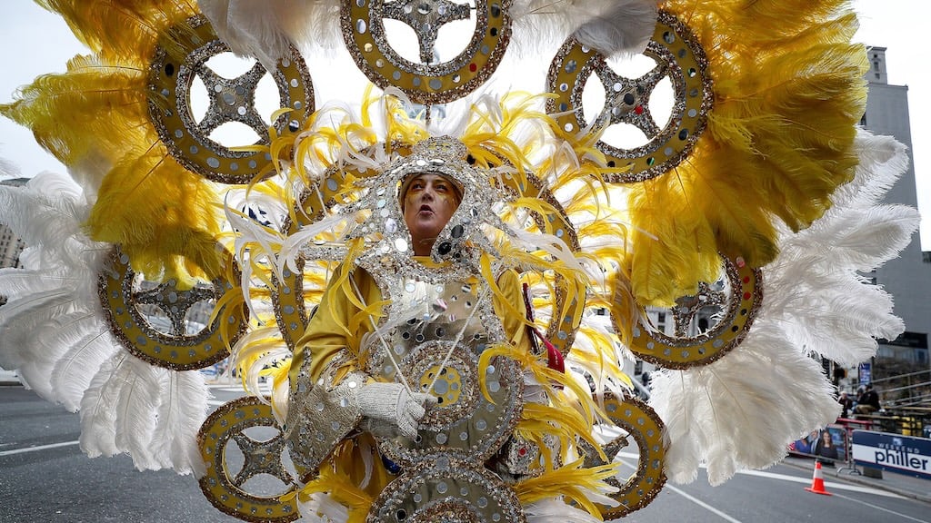 Elaborate costumes and feathers during the Mummers Parade